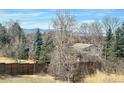 A house with lots of trees and mountain views at 5449 S Locust St, Greenwood Village, CO 80111