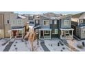 Aerial view of townhomes in a snow-covered community at 23527 E 5Th Pl, Aurora, CO 80018