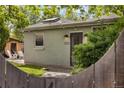 Charming home exterior featuring a cozy porch and well-maintained yard, perfect for relaxing outdoors at 4567 Grove St, Denver, CO 80211