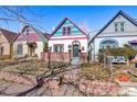 Beautiful home with a well-manicured lawn and charming brick accents at 69 W Cedar Ave, Denver, CO 80223