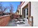 Relaxing patio with brick features, perfect for outdoor seating and enjoyment at 69 W Cedar Ave, Denver, CO 80223