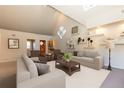 Open-concept living room with vaulted ceilings, modern decor, and ample natural light at 102 S High St, Breckenridge, CO 80424