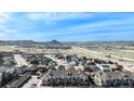 A captivating aerial view of a vibrant residential community with easy highway access and stunning mountain views at 452 Black Feather Loop # 606, Castle Rock, CO 80104