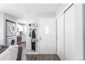 Inviting foyer with coat rack and a glimpse into the living room and kitchen at 1128 S Ventura Cir # B, Aurora, CO 80017