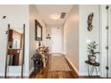 Inviting hallway with hardwood floors, decorative mirror, stylish decor and a warm, welcoming atmosphere at 4200 W 17Th Ave # 611, Denver, CO 80204