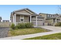 Charming single-Gathering home featuring a two-car garage and well-maintained front yard at 10555 Boston St, Commerce City, CO 80640
