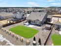 A private backyard with a lush lawn, a wooden fence, and a detached storage shed enhance this property at 1265 Black Haw St, Elizabeth, CO 80107