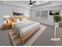 Serene main bedroom with tray ceiling, plush carpeting, and ample natural light from two windows at 950 Avena Ct, Elizabeth, CO 80107