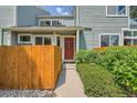 Inviting townhome entrance with a charming walkway, well-maintained shrubs, and a striking front door at 5150 Buckingham Rd, Boulder, CO 80301