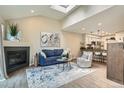Bright living room with a fireplace, modern decor, and an open floor plan at 5150 Buckingham Rd, Boulder, CO 80301