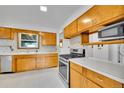 Functional kitchen features stainless steel appliances, ample cabinetry, and plenty of counter space at 485 S Pierson St, Lakewood, CO 80226