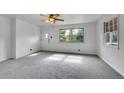 Bright living room features neutral carpet, fresh paint and large windows providing lots of natural light at 485 S Pierson St, Lakewood, CO 80226
