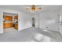 Open-concept living room flows seamlessly into the kitchen, offering a cozy and inviting atmosphere at 485 S Pierson St, Lakewood, CO 80226