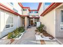 Inviting entryway with a walkway leading to a double door entrance at 990 S Locust St # D, Denver, CO 80224