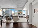 Contemporary living area with floor-to-ceiling windows offering panoramic city views and hardwood floors at 891 14Th St # 3510, Denver, CO 80202