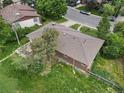 Aerial view of a well maintained single Gathering home with a large yard and mature trees at 8481 E Briarwood Blvd, Centennial, CO 80112