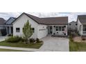 Charming single-Gathering home with a white exterior, a well-manicured lawn, and a two-car garage at 4422 Mt Shavano St, Brighton, CO 80601