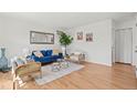 Bright living room with hardwood floors, stylish furnishings, and ample natural light at 7309 W Hampden Ave # 601, Lakewood, CO 80227