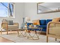 Well-appointed living room showcasing modern furniture, a stylish rug, and natural light at 7309 W Hampden Ave # 601, Lakewood, CO 80227