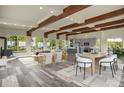 Spacious living room with hardwood floors, fireplace, and large windows showcasing the natural scenery at 586 Alpine Way, Idaho Springs, CO 80452