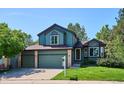 Charming two-story home with a three-car garage and mature landscaping at 5651 S Himalaya Way, Centennial, CO 80015