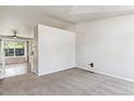 Bright living room with carpet and large windows that let in natural light at 5651 S Himalaya Way, Centennial, CO 80015