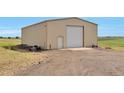 Large detached garage with ample space for storage and projects at 14825 Almstead St, Hudson, CO 80642