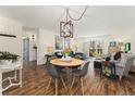 Open-plan living area with wood floors and a sliding glass door to the outdoors at 7020 E Girard Ave # 209, Denver, CO 80224