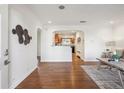 Bright living room showcasing hardwood floors, neutral paint, and an open floor plan for flexible living at 2633 Quitman St, Denver, CO 80212