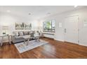 Cozy living room featuring hardwood floors, lots of natural light, neutral paint, and comfortable seating at 2633 Quitman St, Denver, CO 80212
