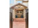 Inviting entrance featuring a stone facade, custom wooden doors, and manicured planters creating a welcoming ambiance at 155 S Poplar St, Denver, CO 80230
