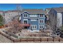 Rear exterior showing a two-story blue home with a deck and yard at 4688 Cedar Glen Pl, Castle Rock, CO 80109