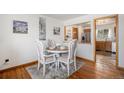Cozy dining space featuring an elegant table setting near an open kitchen at 10983 W Exposition Pl, Lakewood, CO 80226