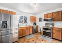 Modern kitchen equipped with stainless steel appliances and efficient storage at 10983 W Exposition Pl, Lakewood, CO 80226