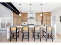 Bright kitchen with bar seating, stainless steel appliances and pendant lighting at 1880 S Adams St, Denver, CO 80210