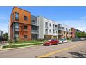 Modern exterior showcasing a multi-story building with brick, metal, and ample street parking at 2525 Arapahoe St # Rd315, Denver, CO 80205