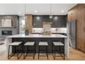 Modern kitchen features a large island, sleek countertops, and stainless steel appliances at 2395 N Emerson St, Denver, CO 80205