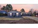Charming single-story home with a gray brick exterior and manicured landscaping at 3802 E Costilla Ave, Centennial, CO 80122