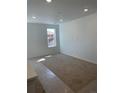 Well-lit bedroom with plush carpet, recessed lighting, and a large window at 6750 Juniper Dr, Thornton, CO 80602