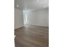 Bright, spacious living room with hardwood floors and ample natural light at 6750 Juniper Dr, Thornton, CO 80602