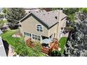 Backyard view of home with a wooden deck with outdoor furniture and a landscaped yard and patio at 2980 E 135Th Dr, Thornton, CO 80241