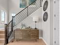 Stylish foyer features wood floors, modern staircase, and decorative accents at 6244 N Lisbon St, Aurora, CO 80019