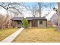 Charming home featuring a well-maintained lawn and inviting walkway, showcasing curb appeal at 1232 Wabash St, Denver, CO 80220