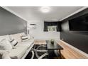 Relaxing living room with natural light, hardwood floors, and a flat screen TV at 1390 N Emerson St # 101, Denver, CO 80218