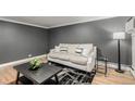 Comfortable living room with a soft sofa, hardwood floors, and a stylish rug at 1390 N Emerson St # 101, Denver, CO 80218