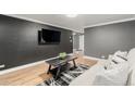 Well-lit living room featuring hardwood floors, and a stylish area rug at 1390 N Emerson St # 101, Denver, CO 80218