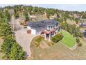 Beautiful home boasts an attached garage, solar panels and meticulous landscaping on a sprawling lot at 260 Dekker Dr, Golden, CO 80401