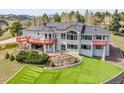 Stunning home has multiple decks, solar panels, an artificial lawn, and professionaly landscaped terrace at 260 Dekker Dr, Golden, CO 80401