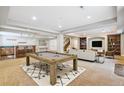 Finished basement features a pool table, bar area, and cozy seating area at 6085 Nile Cir, Golden, CO 80403