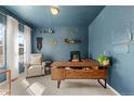 Stylish office space featuring a modern desk, comfortable chair, and elegant decor at 244 Chipeta Way, Lochbuie, CO 80603